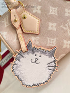 Louis Vuitton cat-shaped key pouch charm with tan and gray stitched face