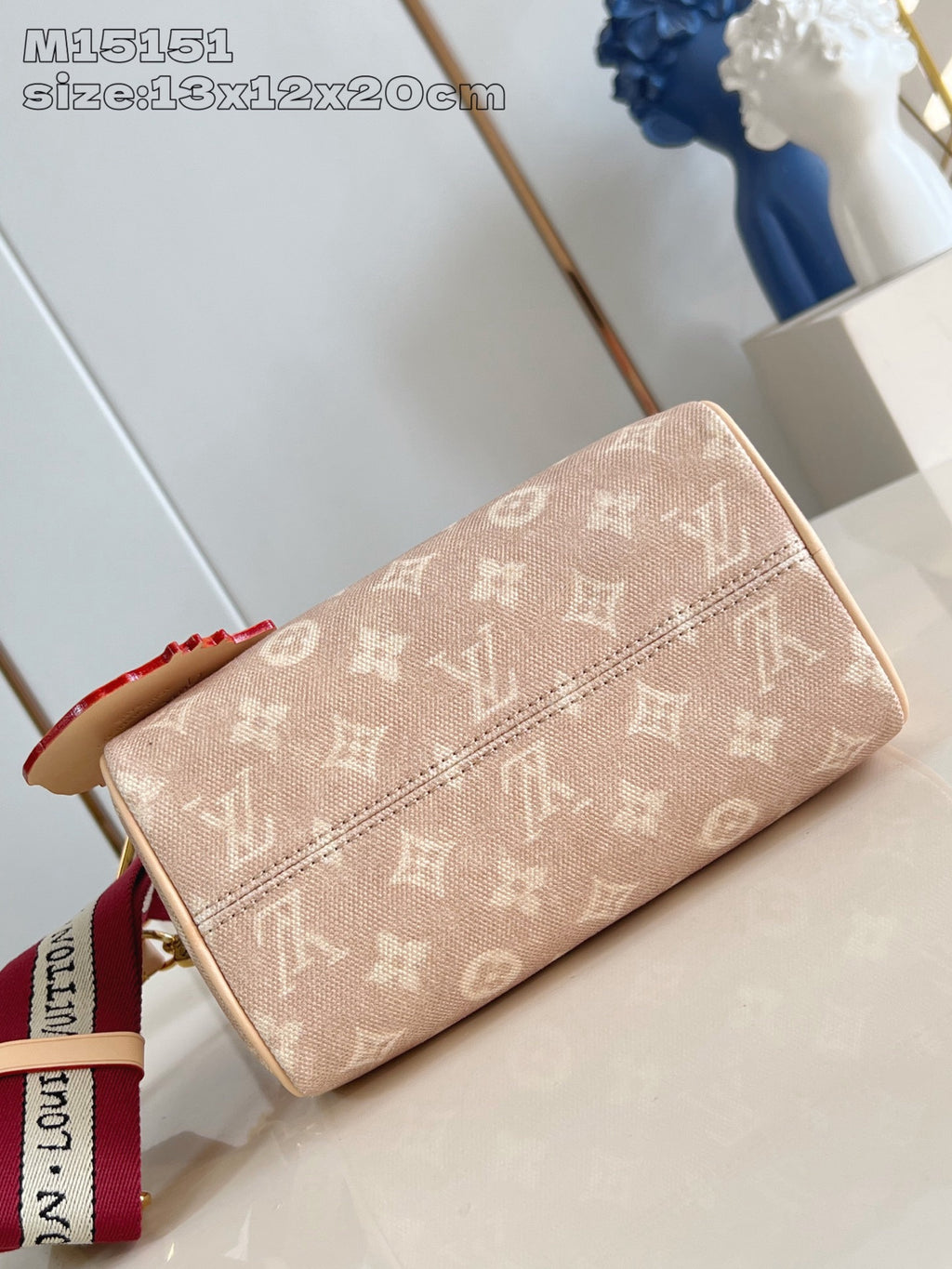 Louis Vuitton tan monogram wristlet pouch with top zipper and red strap