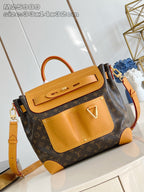 Louis Vuitton monogram handbag with tan leather trim and top handle, crossbody strap