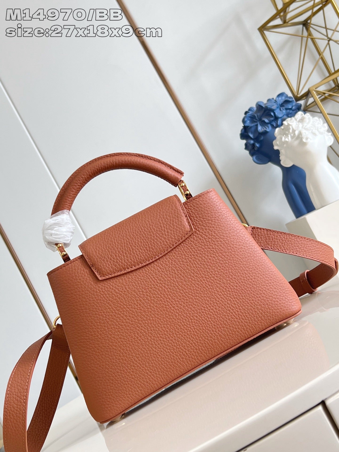 Pink structured top-handle handbag with detachable shoulder strap and gold trim
