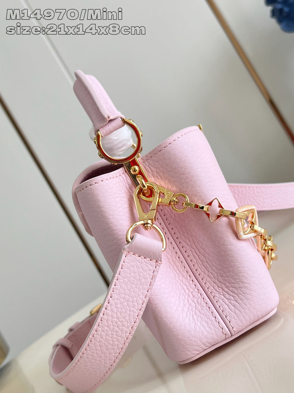 Louis Vuitton mini handbag light pink with top handle, shoulder strap, and gold hardware