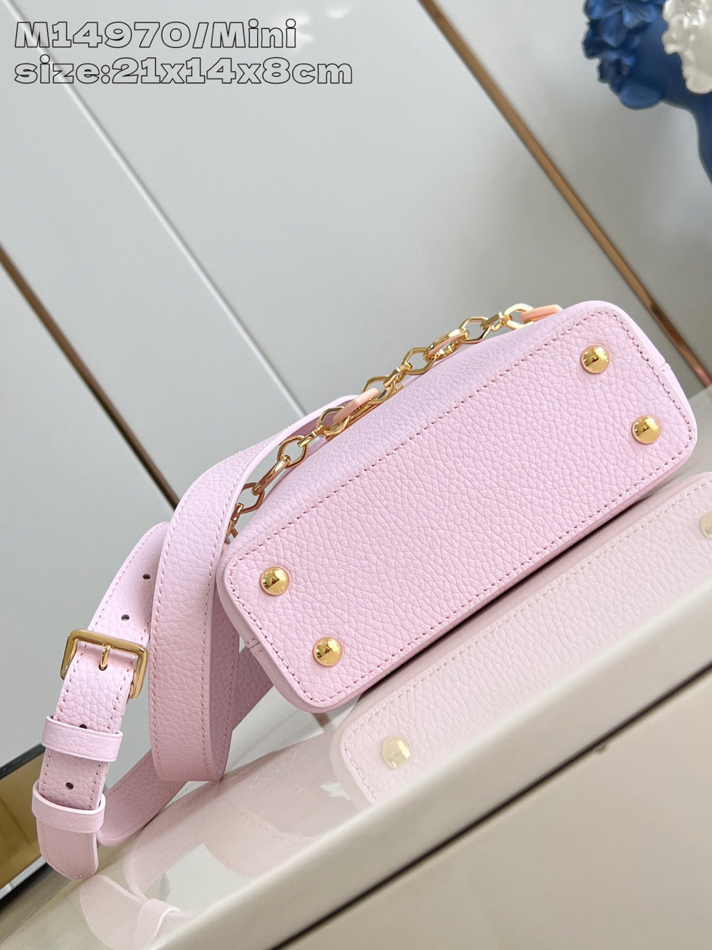 Louis Vuitton mini handbag light pink with gold snap hardware and chain shoulder strap