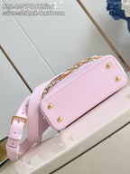 Louis Vuitton mini handbag light pink with gold snap hardware and chain shoulder strap