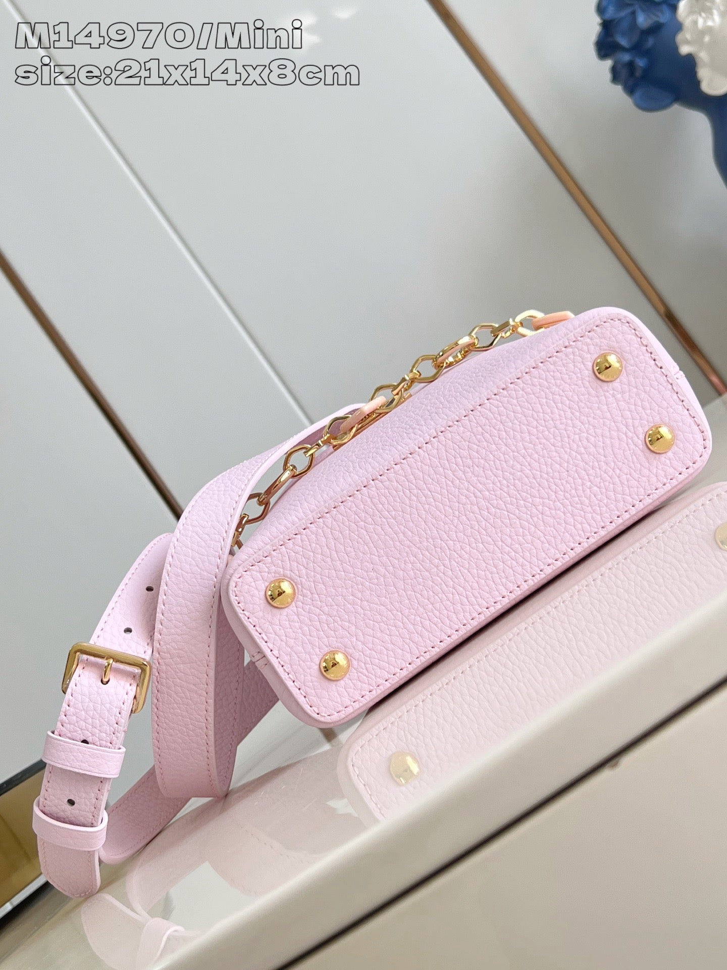 Louis Vuitton mini handbag light pink with gold snap hardware and chain shoulder strap