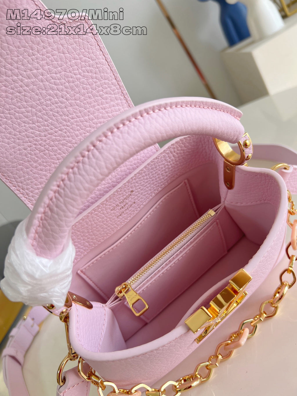 Louis Vuitton mini handbag open top with light pink lining and gold chain shoulder strap
