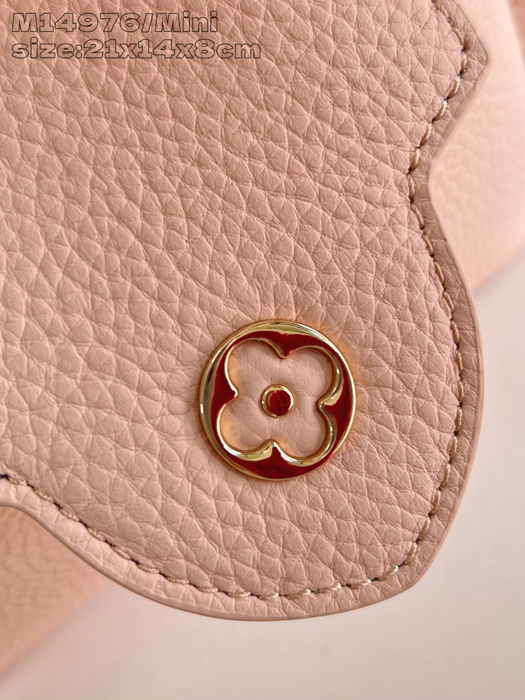 Louis Vuitton mini handbag corner, flower tab with gold button on pink leather