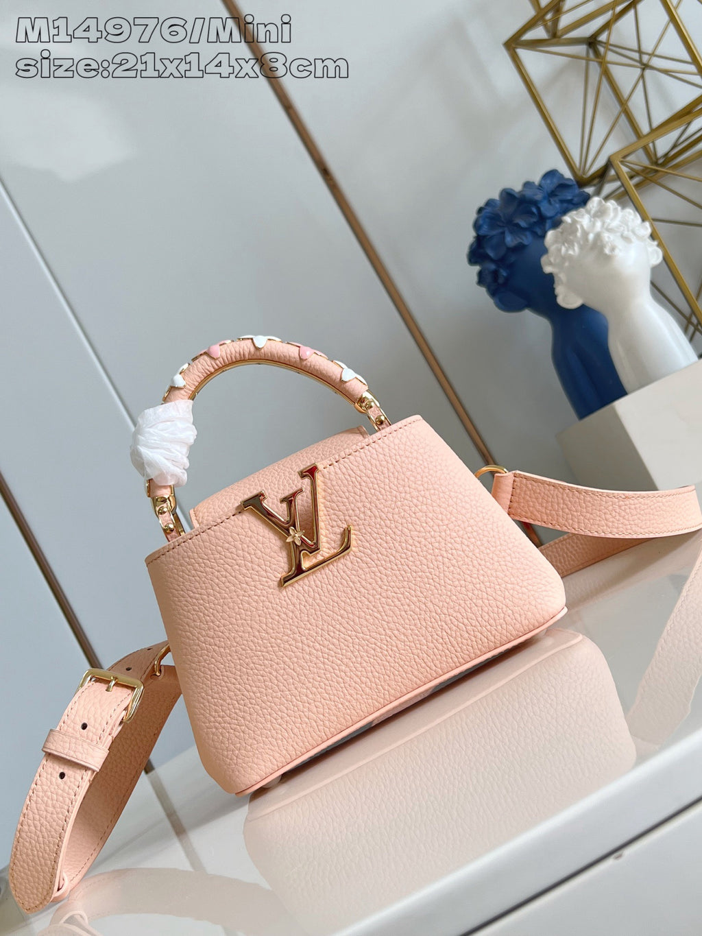 Louis Vuitton mini handbag, pink textured leather with gold logo and top handle