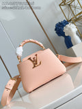 Louis Vuitton mini handbag, pink textured leather with gold logo and top handle