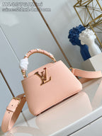 Louis Vuitton mini handbag, pink textured leather with gold logo and top handle