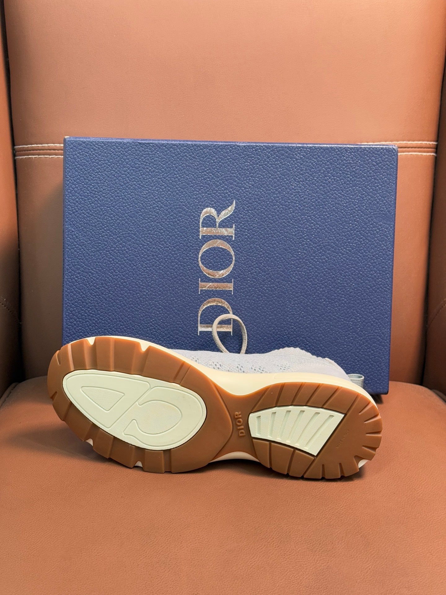 Dior unisex sneaker outsoles, textured beige sole with dark tread