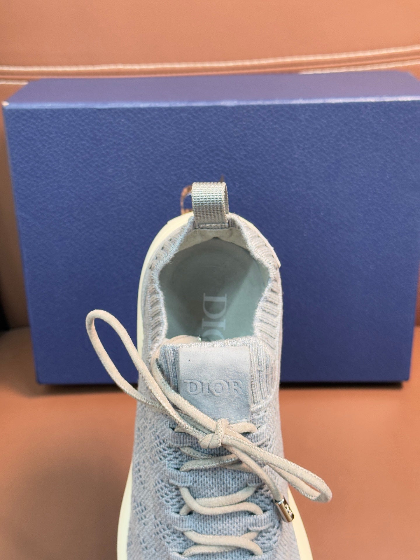 Dior unisex sneaker tongue and laces, light blue knit with cushioned collar