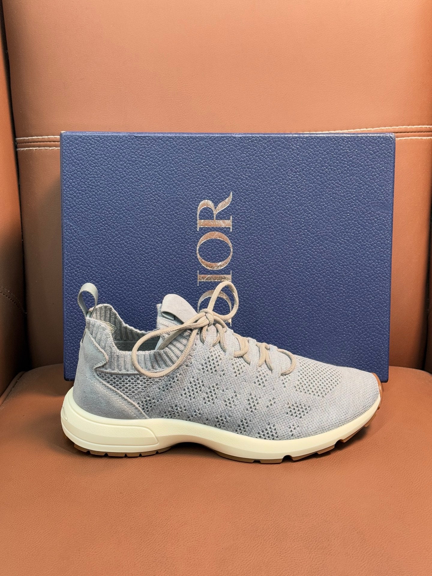 Dior unisex lace-up sneakers with light blue knit upper and cream sole
