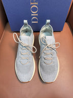 Dior unisex sneakers with light blue knit uppers and white laces