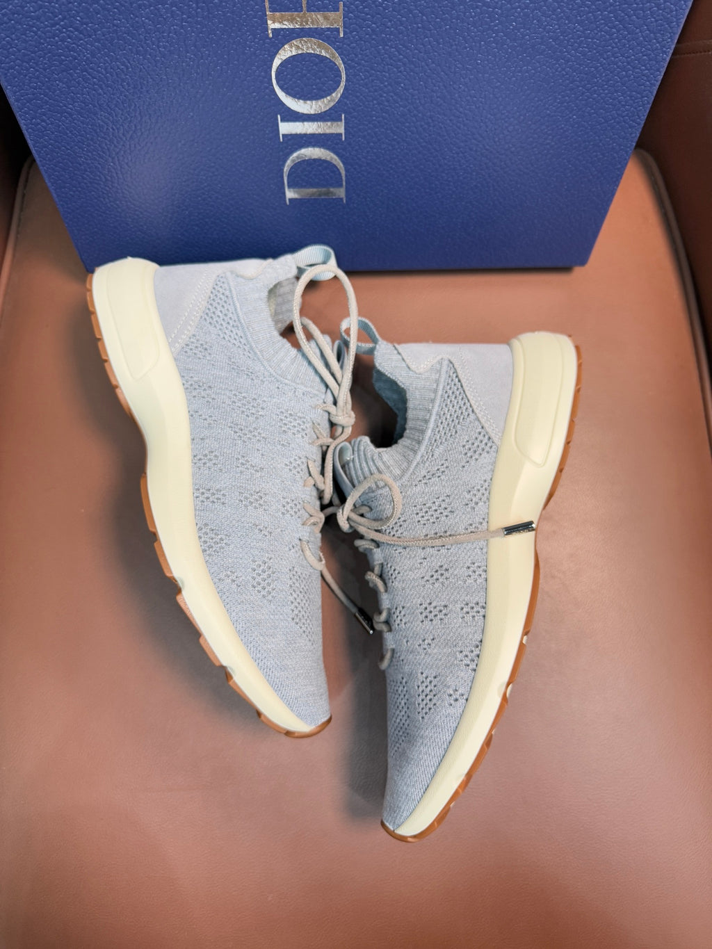 Dior unisex sneakers with light blue knit upper, cushioned collar, beige sole