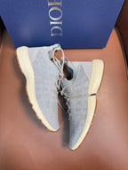 Dior unisex sneakers with light blue knit upper, cushioned collar, beige sole
