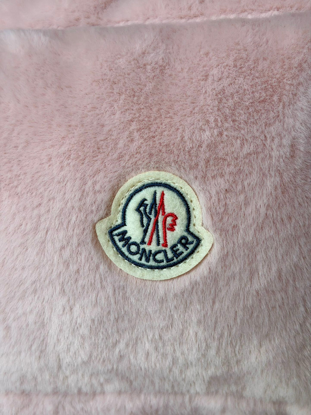 Moncler round logo patch on pink padded gilet panel
