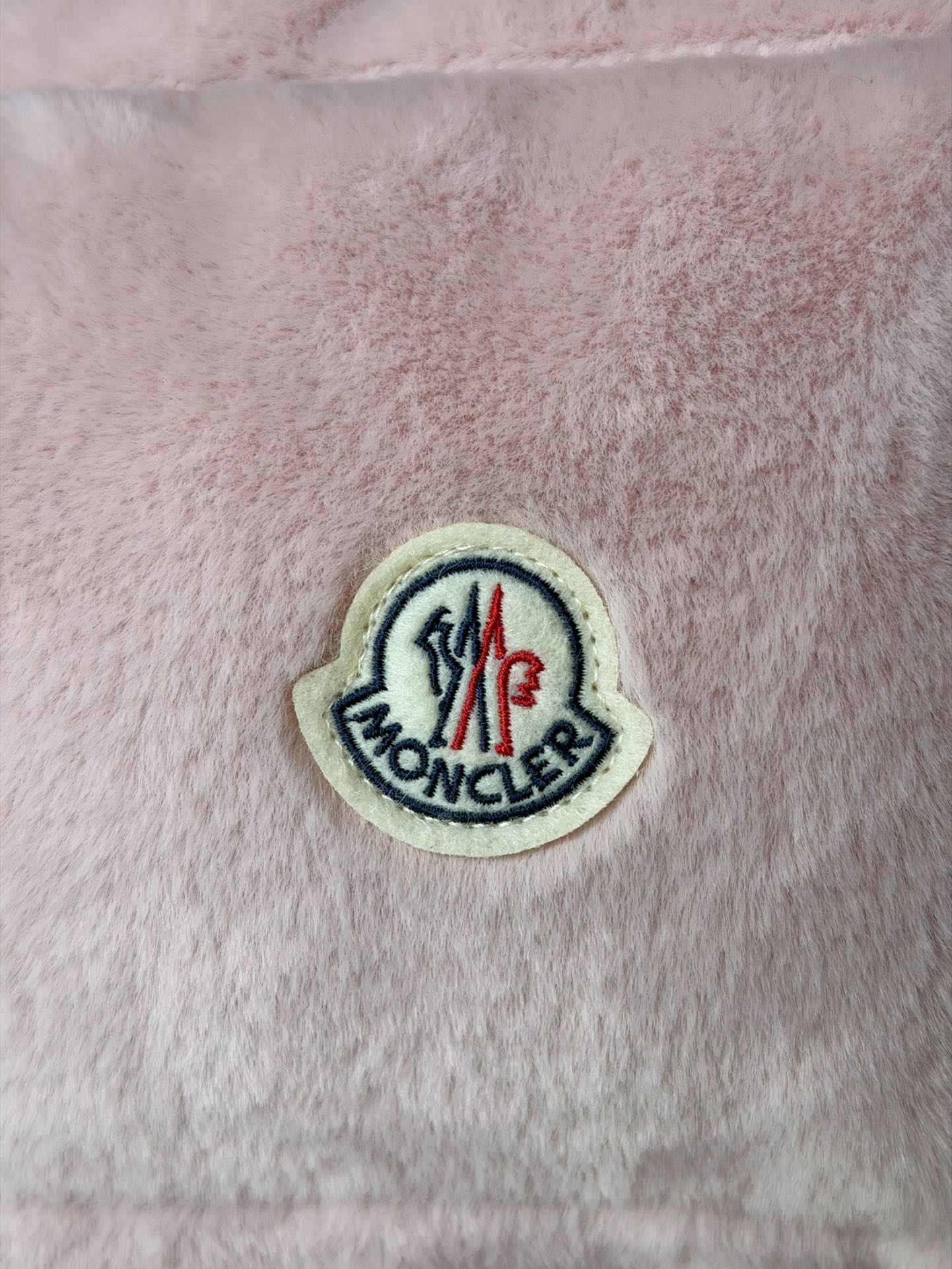 Moncler round logo patch on pink padded gilet panel