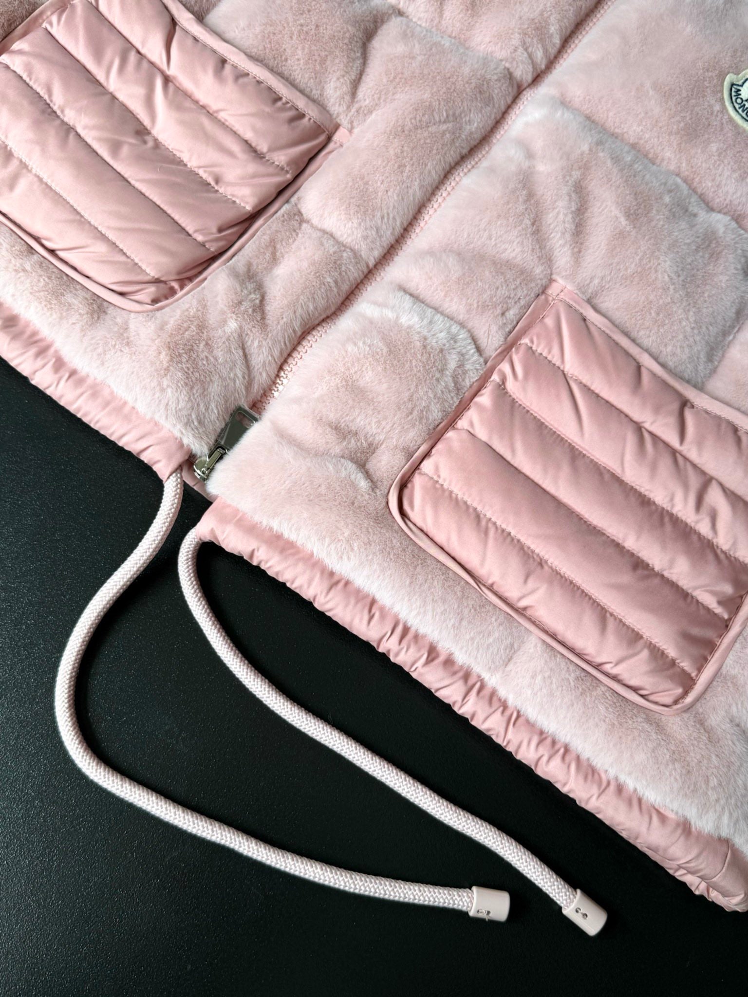 Moncler pink faux-fur gilet with drawstring cords and quilted pocket panels