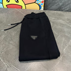 Prada black drawstring jogger pants with elastic waistband and logo patch