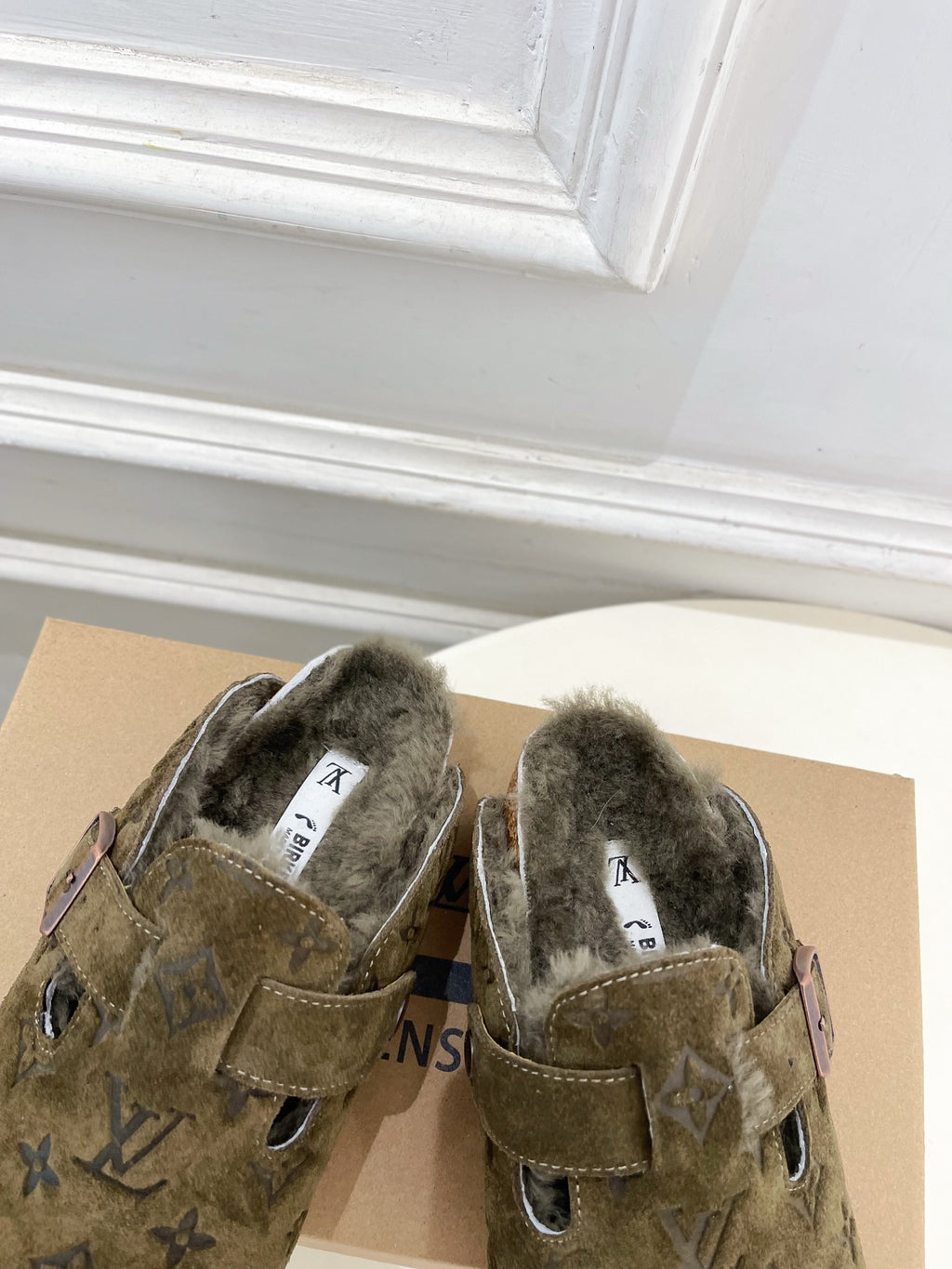 Olive green monogram sandals, shearling-lined footbed with two buckle straps
