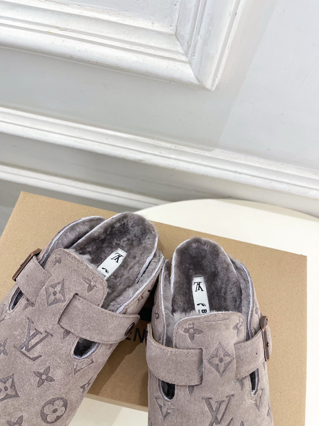 Monogram slide sandals pair, dark taupe suede, padded fuzzy interior and strap buckles