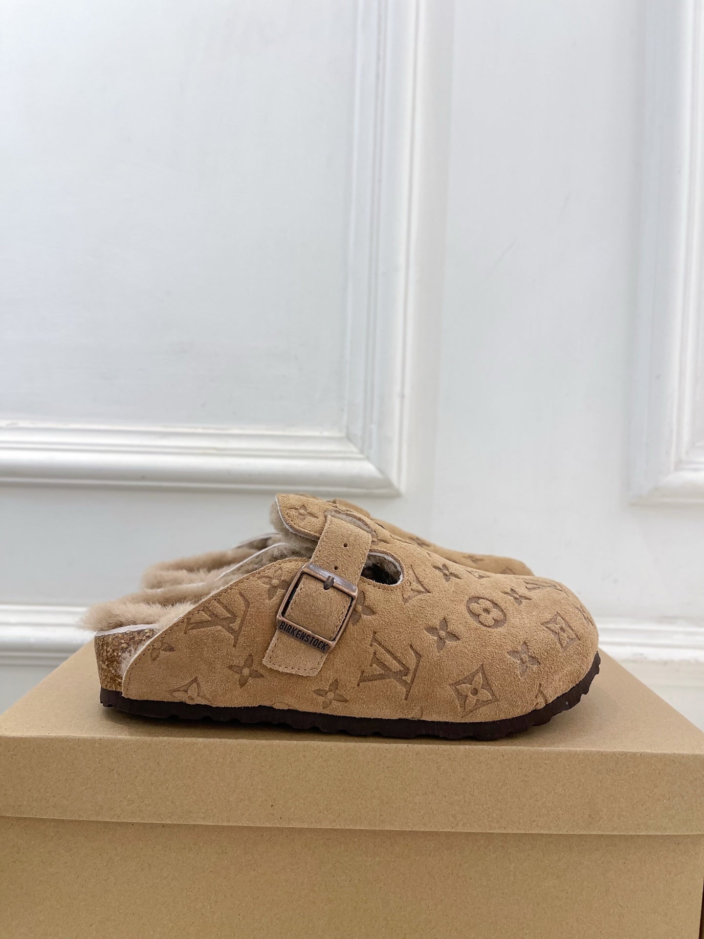 Tan Louis Vuitton monogram buckle slide sandals with plush shearling lining and strap