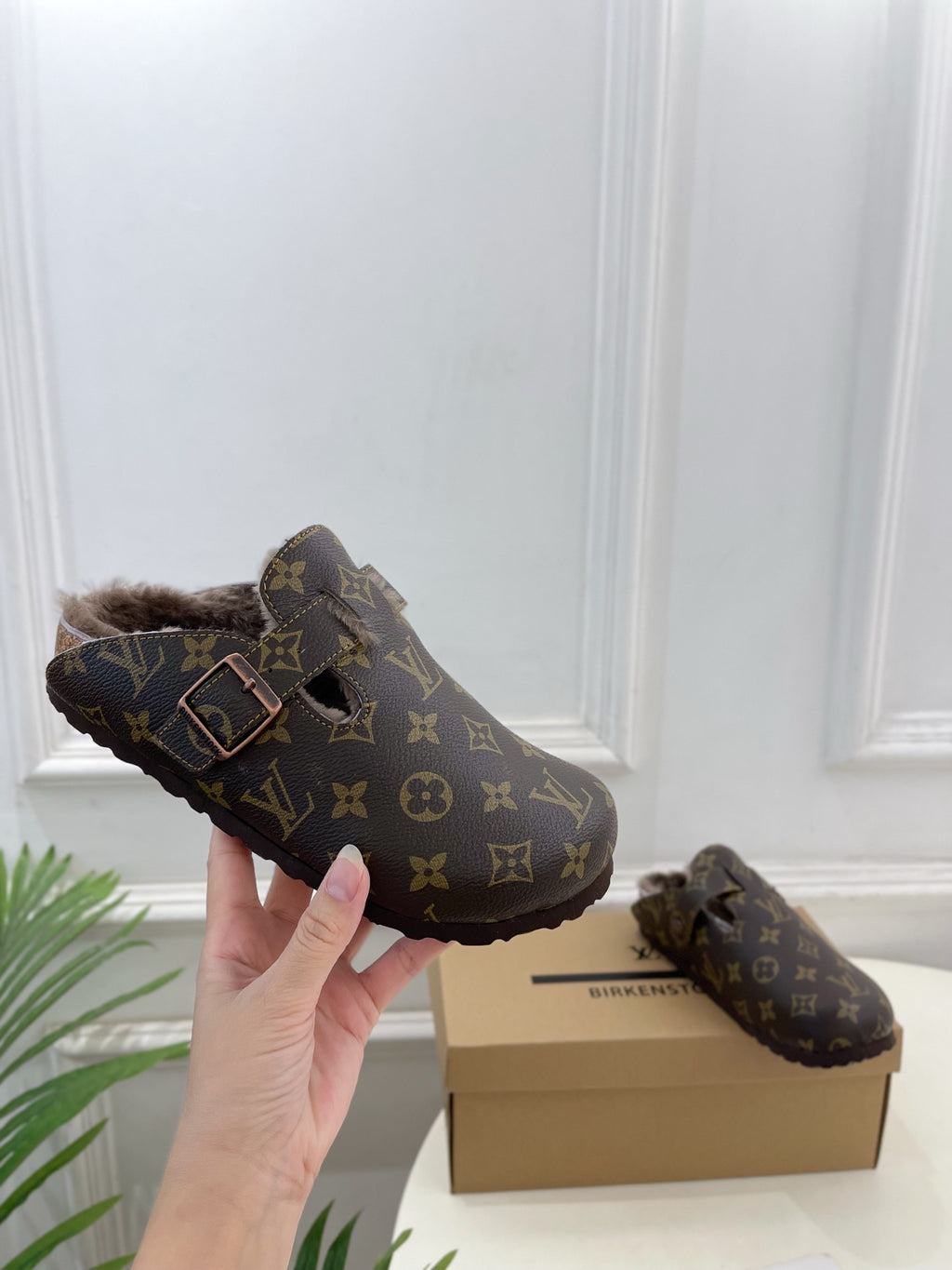 Louis Vuitton monogram sandals with two buckled straps and plush faux-fur lining
