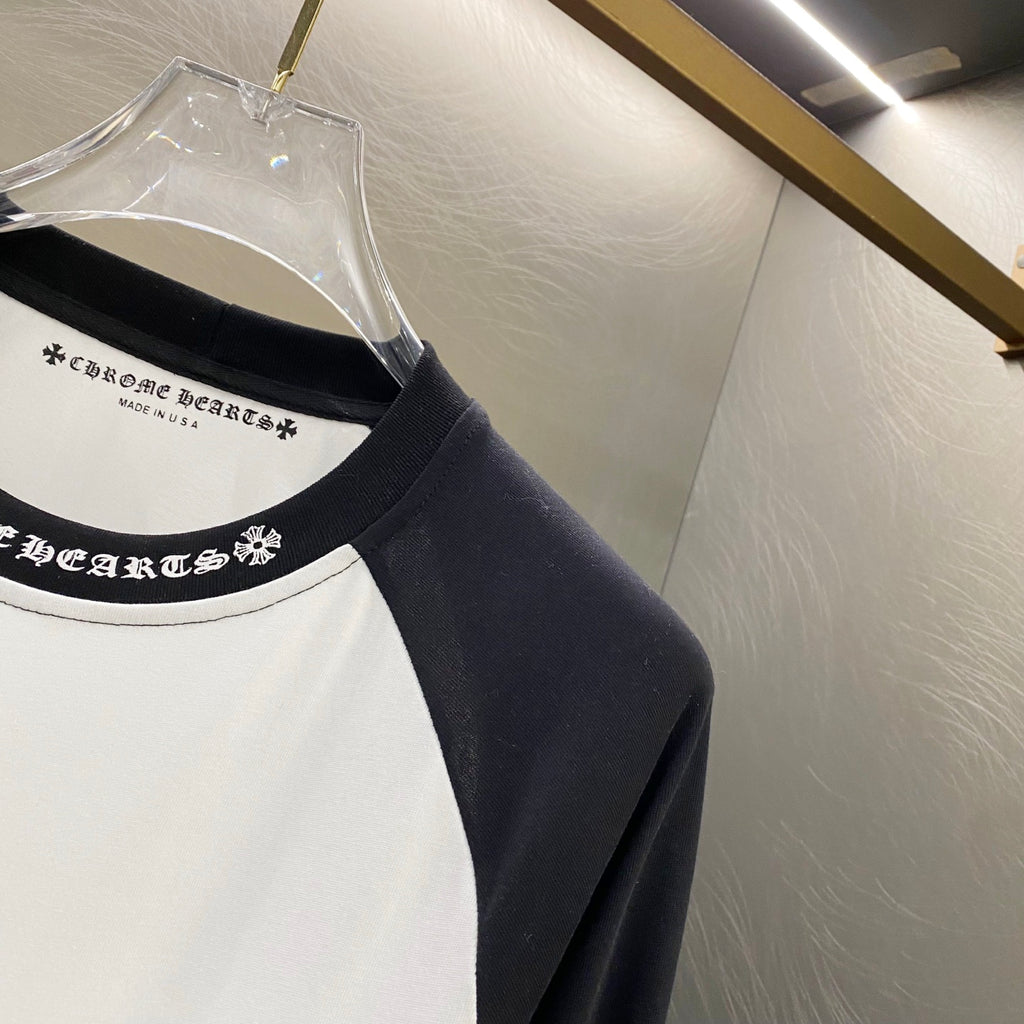 Raglan long-sleeve neckline with black collar and printed text band
