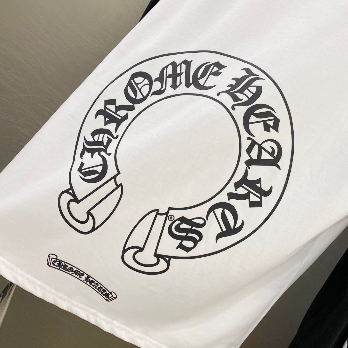 White T-shirt with large circular graphic on back panel