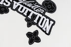 White long-sleeve sweatshirt logo close-up with outlined Louis Vuitton text