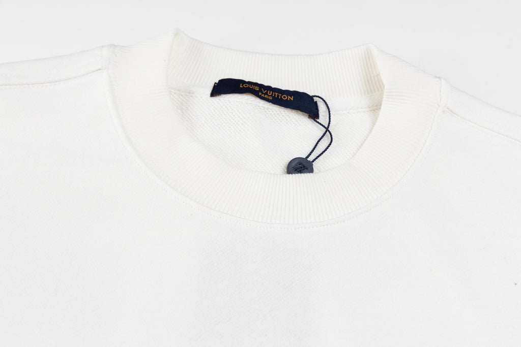 White long-sleeve sweatshirt neckline with ribbed collar and neck label