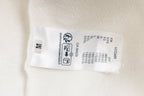 White long-sleeve sweatshirt care label with size and fabric info
