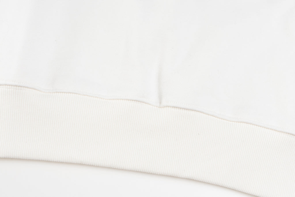 White long-sleeve sweatshirt ribbed hem with double-stitching detail