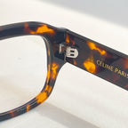Celine tortoise eyeglasses close-up of temple hinge with logo