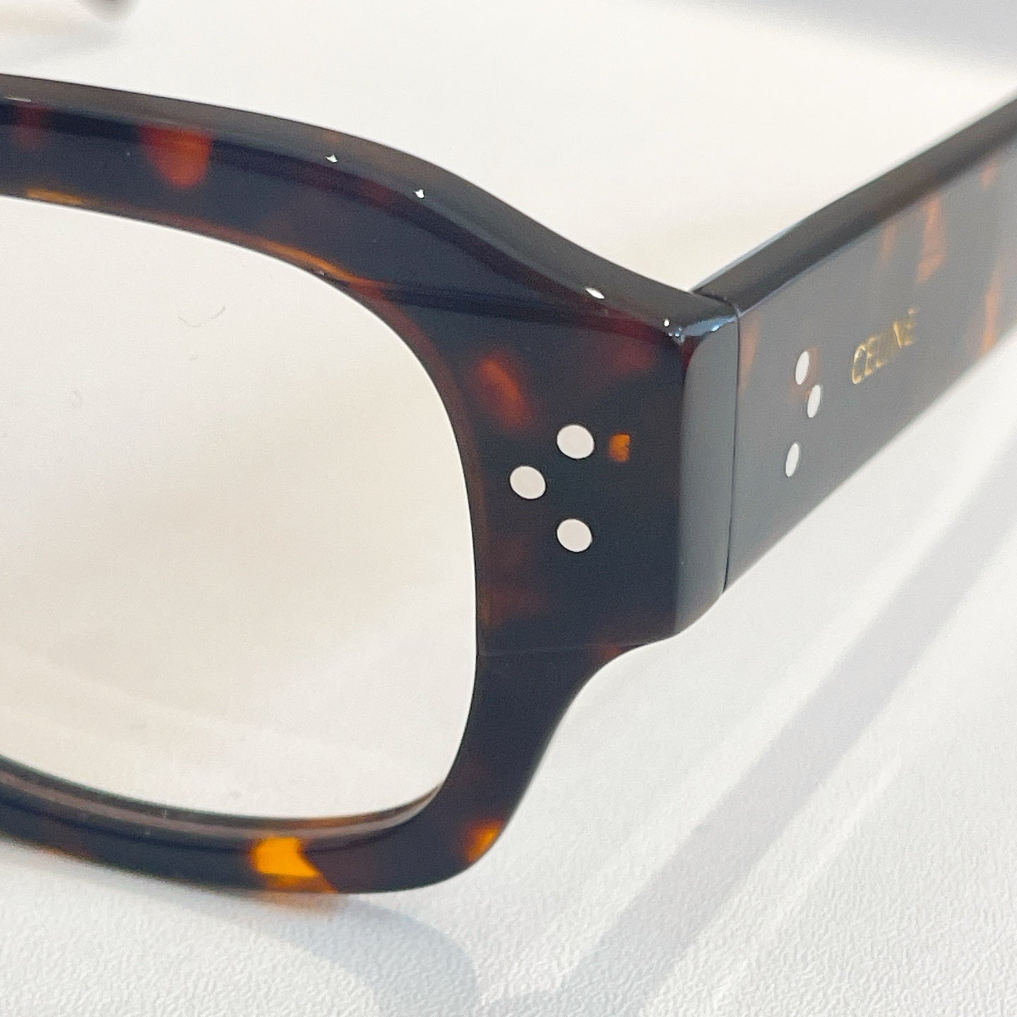 Celine tortoise eyeglass frame close-up with round clear lenses
