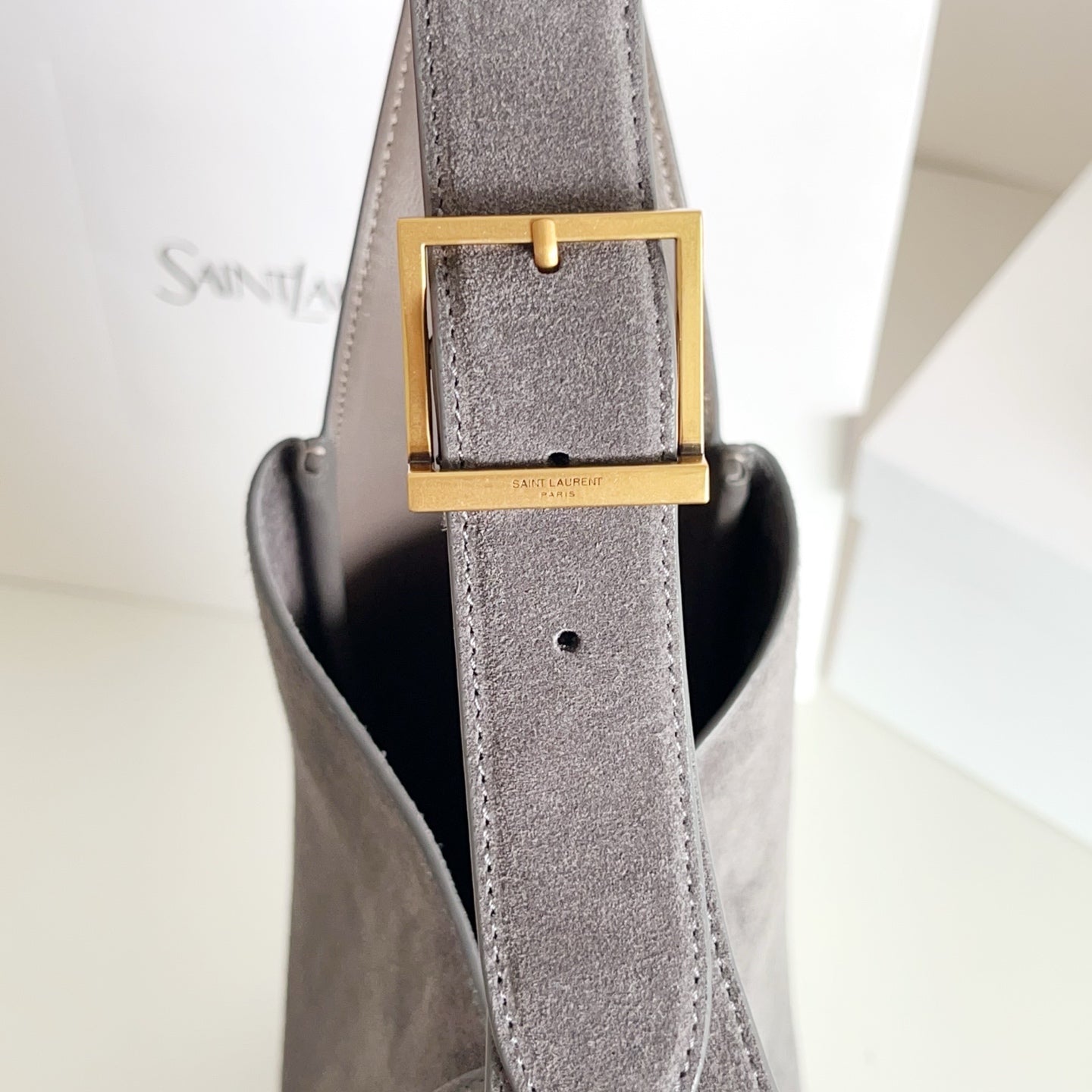 YSL bag, gray strap with gold rectangular buckle hardware