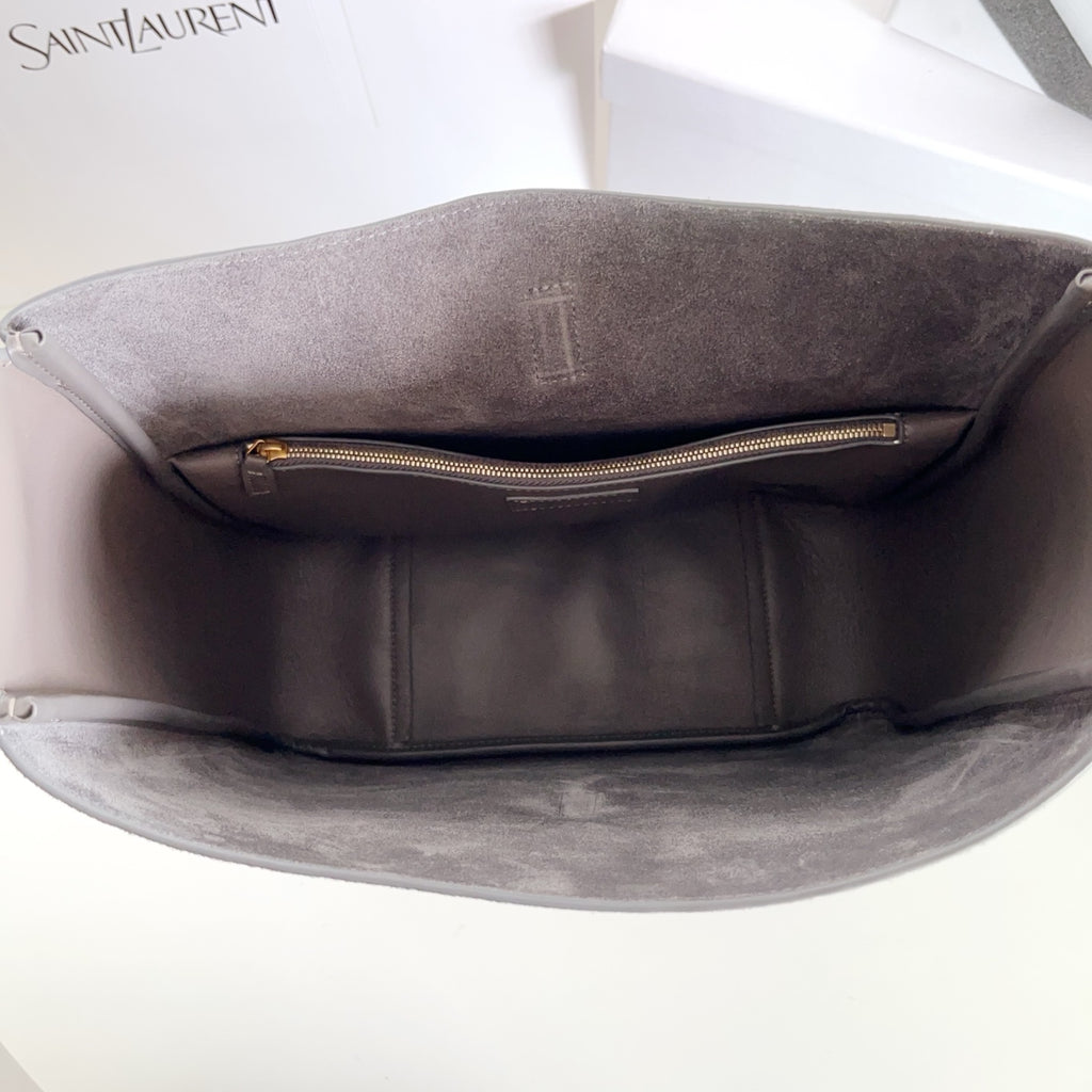 YSL bag, gray interior tote with center zip pocket and gold zipper pull