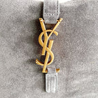 YSL bag, gray leather charm with gold YSL monogram and small hardware