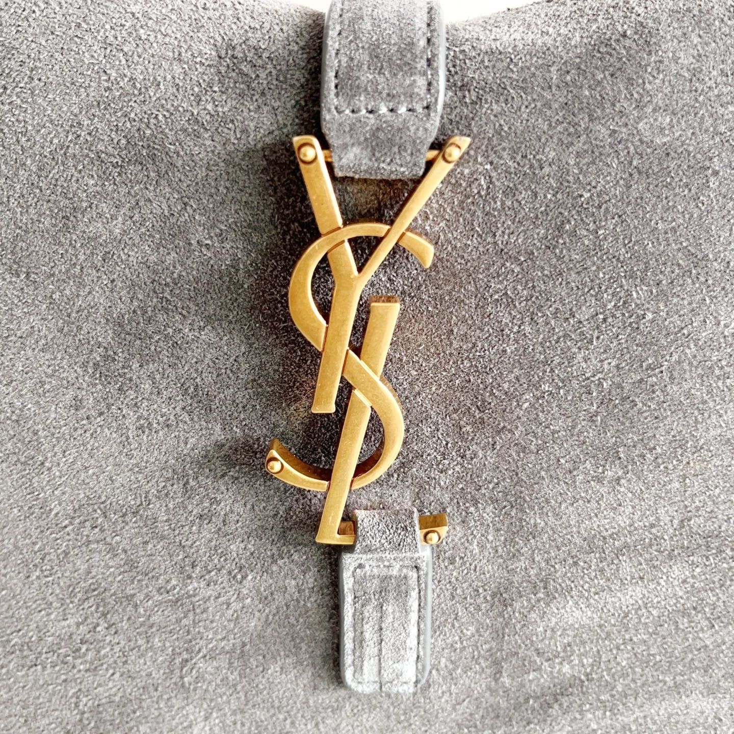YSL bag, gray leather charm with gold YSL monogram and small hardware