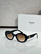 Celine round sunglasses with dark lenses and black acetate frames