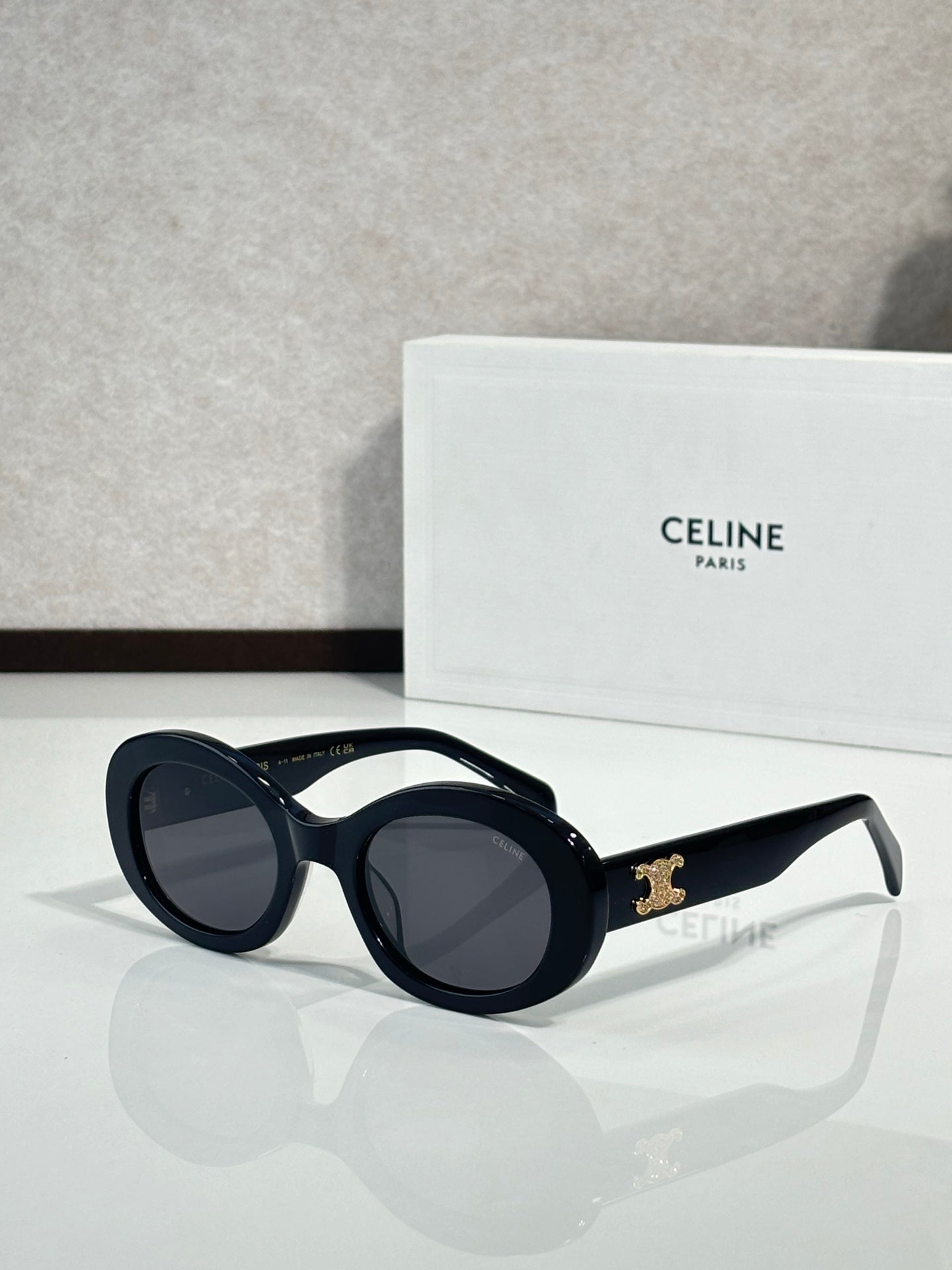 Celine round sunglasses with dark lenses and glossy black acetate frames