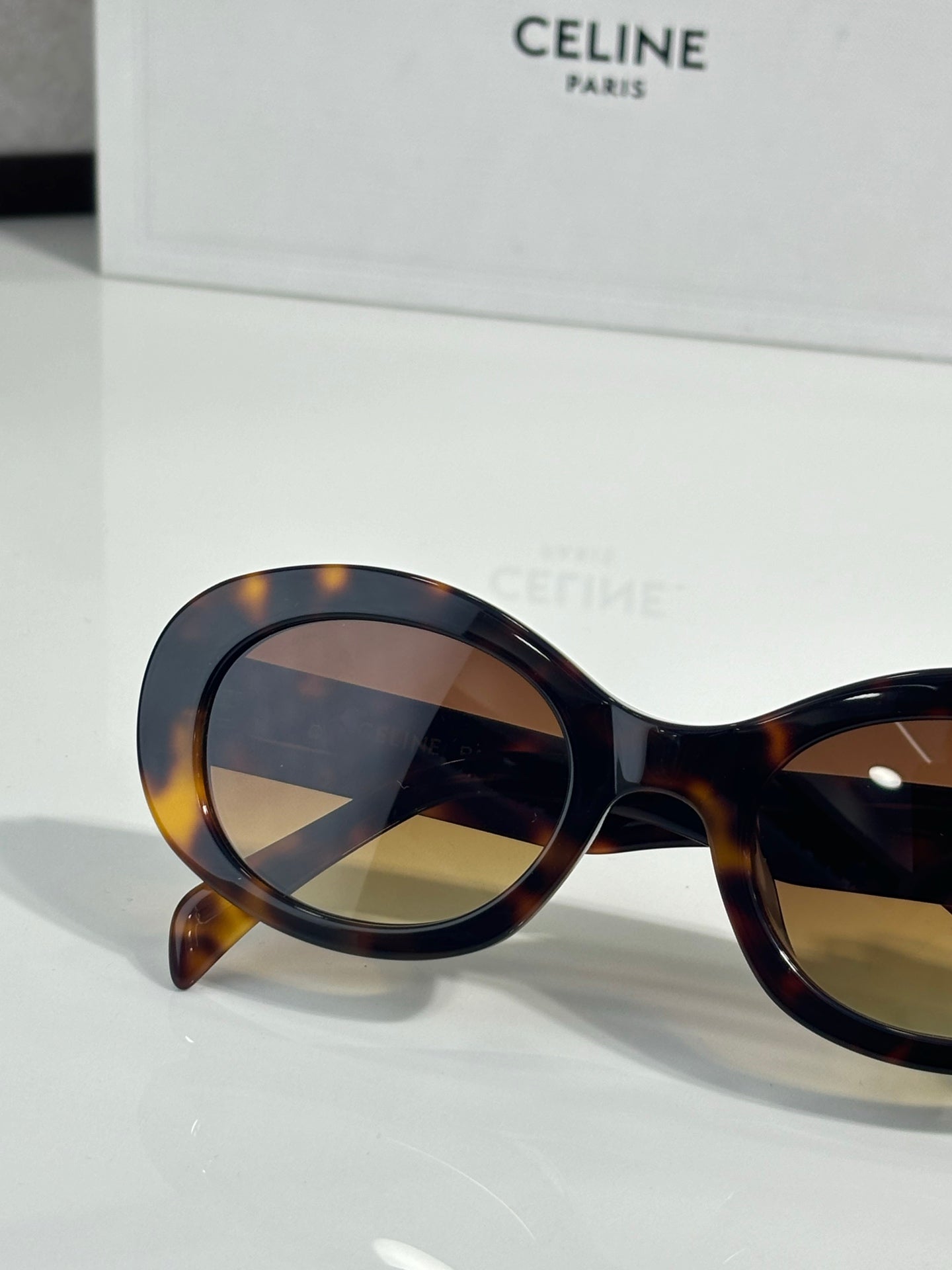 Celine tortoise round sunglasses with dark lenses and curved acetate frame