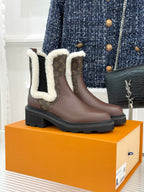 Brown Louis Vuitton ladies ankle boots with monogram panels and white faux-fur trim