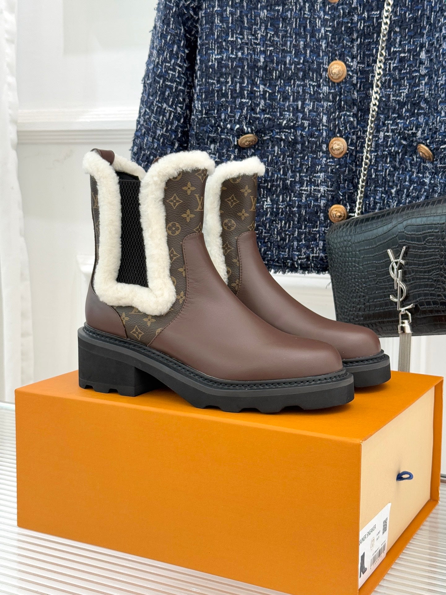 Brown Louis Vuitton ladies ankle boots with monogram panels and white faux-fur trim