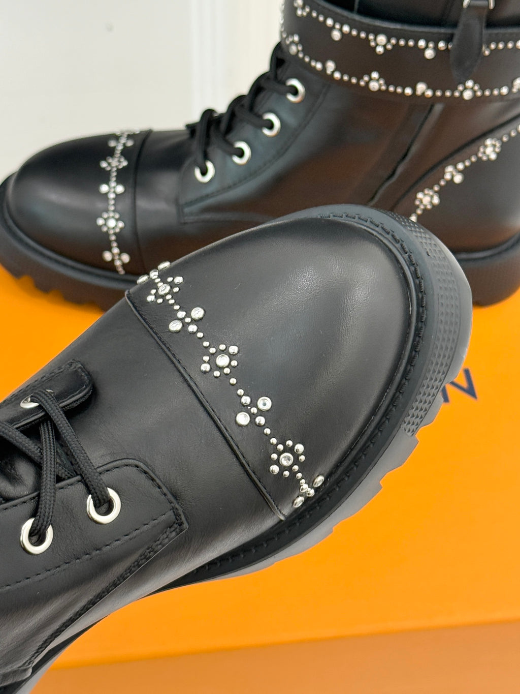 Louis Vuitton black leather ankle boot toe with studded accents