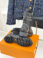 Louis Vuitton black boot outsoles and heels on orange box