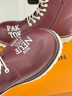 Burgundy Louis Vuitton lace-up ankle boot toe detail with printed text and white laces