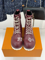 Burgundy Louis Vuitton lace-up ankle boots with front laces and LV/V emblems, chunky white sole