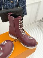 Burgundy Louis Vuitton lace-up ankle boots with side zipper and V logo patch, white sole