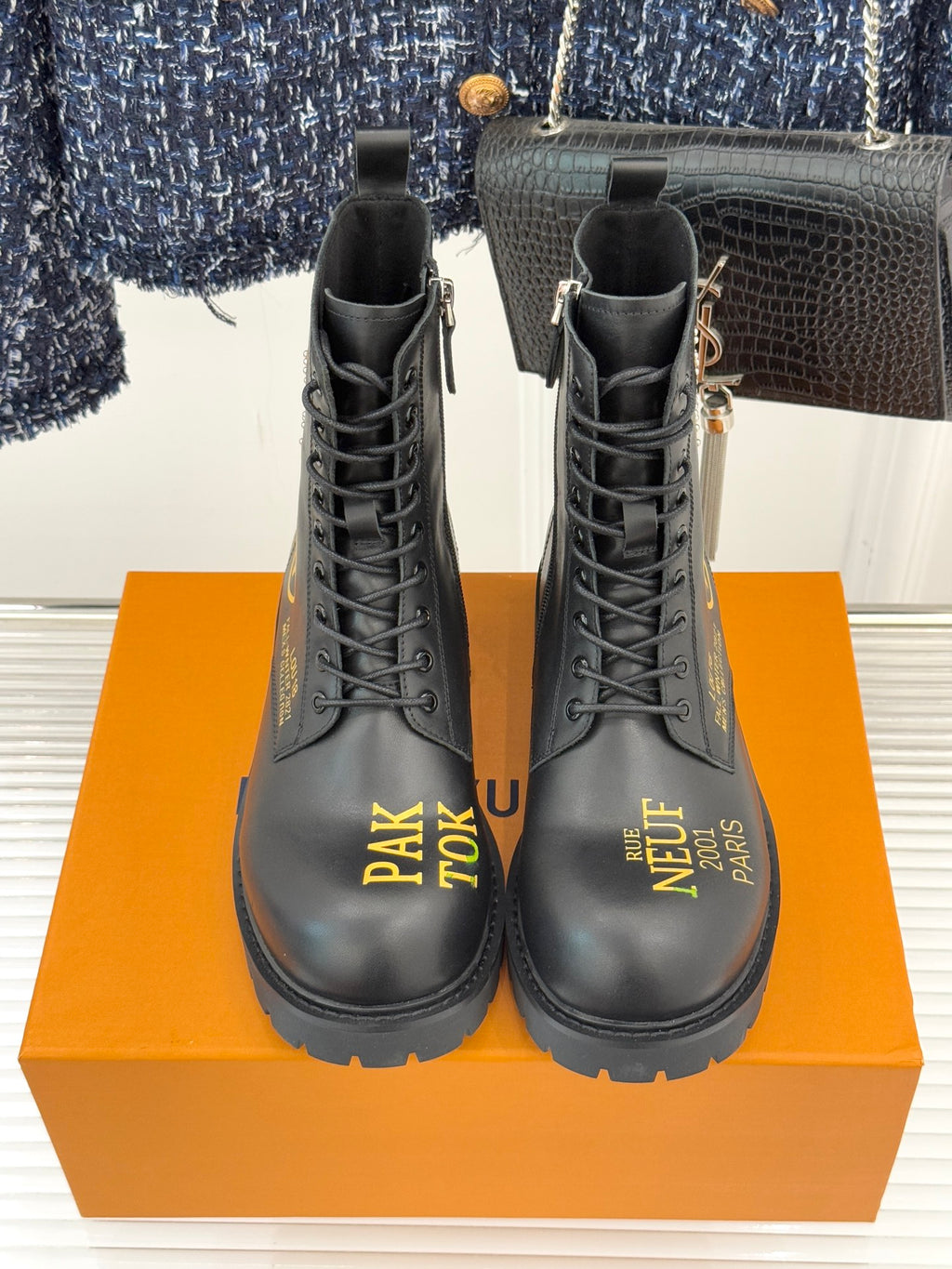 Louis Vuitton ladies lace-up ankle boots, black leather, front view, gold zipper pull